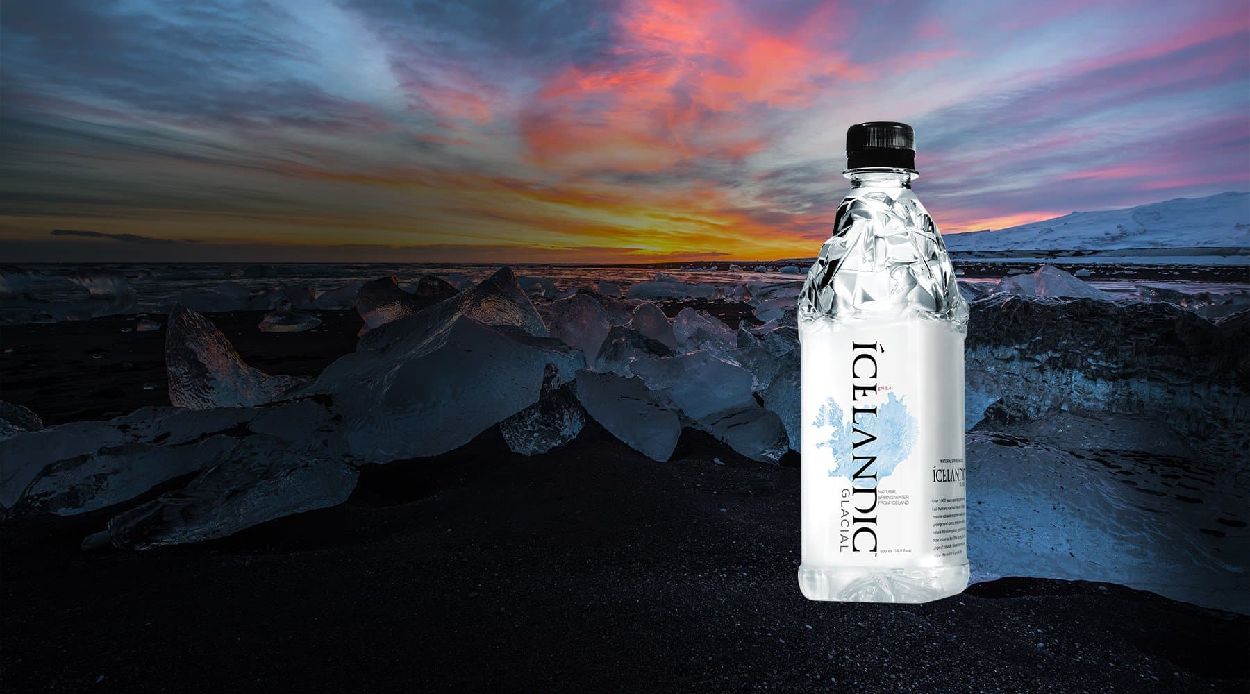 Sunset background amongst glaciers with Icelandic Glacial water bottle